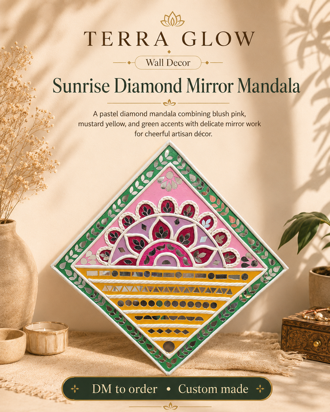 A diamond-shaped decorative mirror mandala by Terra Glow, shown hanging on a beige wall in a styled home setting. The mandala features a pastel pink and green central design with yellow and red geometric patterns.
