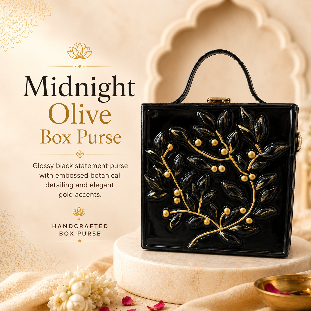 A glossy black box-shaped handbag with embossed botanical gold detailing and gold leaf accents, displayed on a cream pedestal with promotional text reading 'Midnight Olive Box Purse' on the left.
