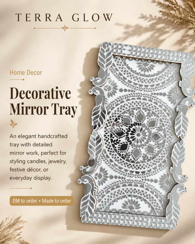 Decorative mirror tray with intricate floral mandala cutout patterns and ornate leafy borders, shown on a beige background with 'TERRA GLOW' branding and product text.