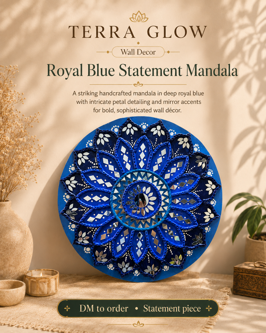 A round blue mandala wall decor piece with intricate white and gold detailing, displayed on a beige surface with decorative dried flowers, bowls, and a plant. Text at the top reads 'TERRA GLOW Wall Decor Royal Blue Statement Mandala' with a note to 'DM to order - Statement piece'.
