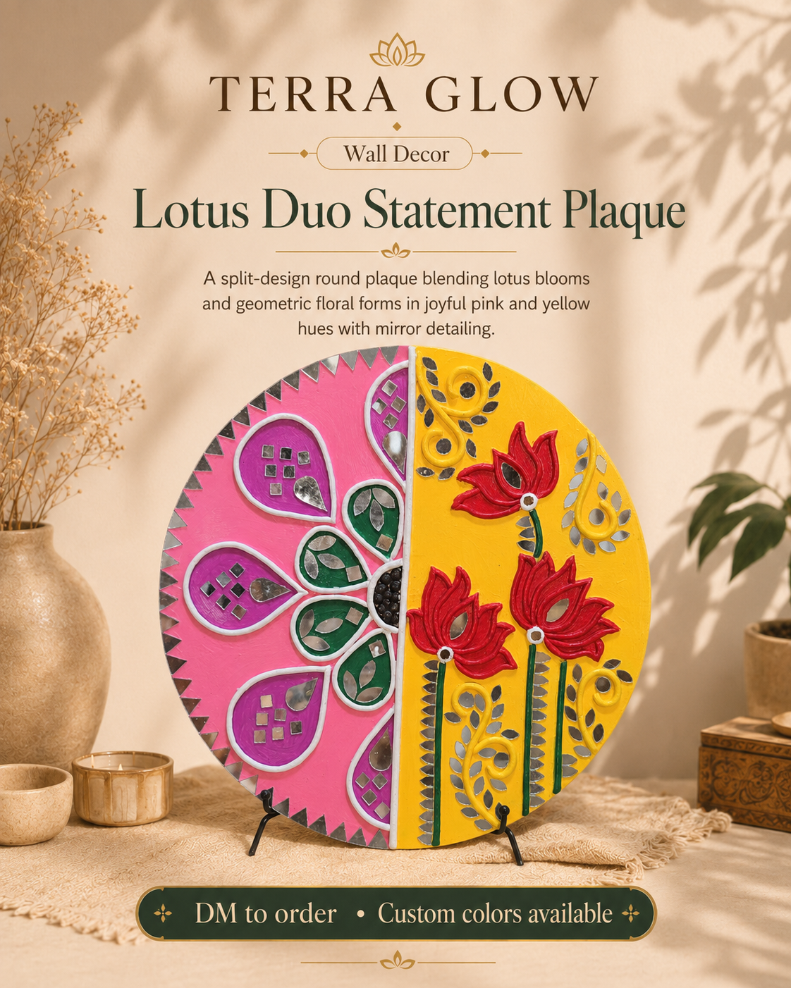 Terra Glow Lotus Duo Statement Plaque wall decor shown as a circular split-design plaque with pink and yellow floral sections, displayed on a table with decorative props and text describing the product.